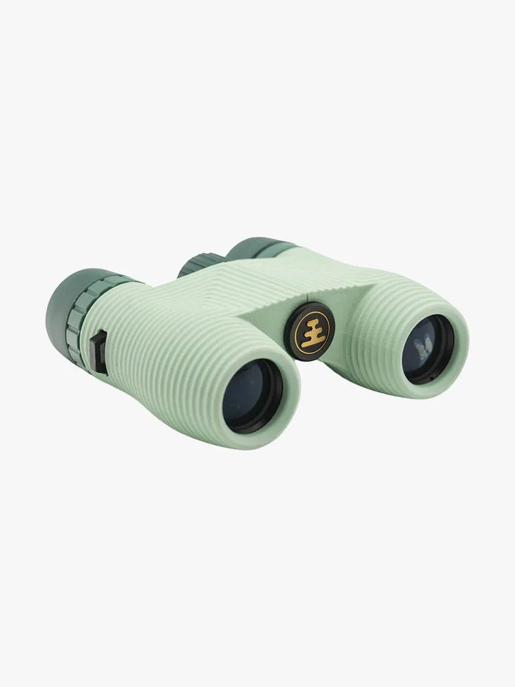 A pair of green binoculars.