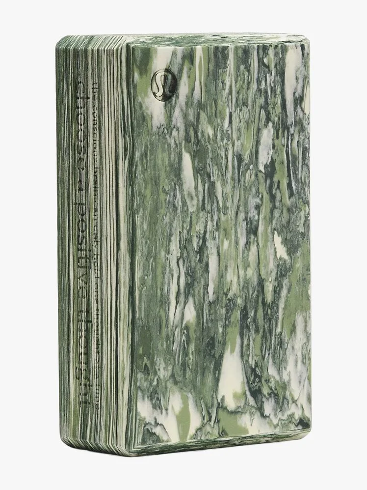A marbled green yoga block.