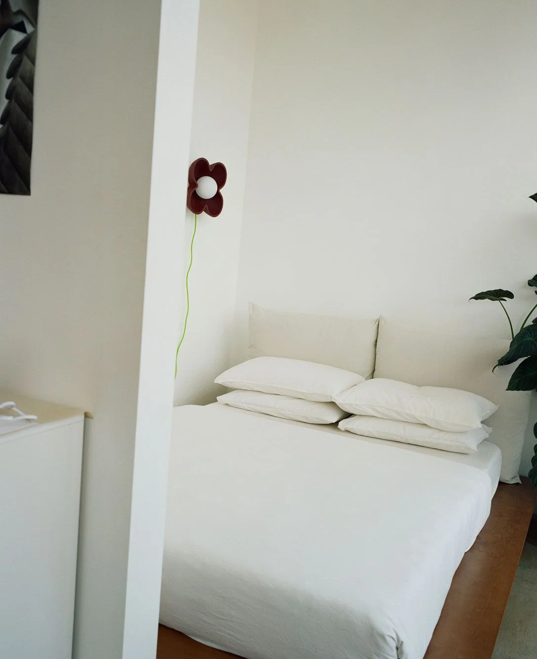 Image may contain Cushion Home Decor Indoors Interior Design Furniture Pillow Bed Flower Plant and Potted Plant