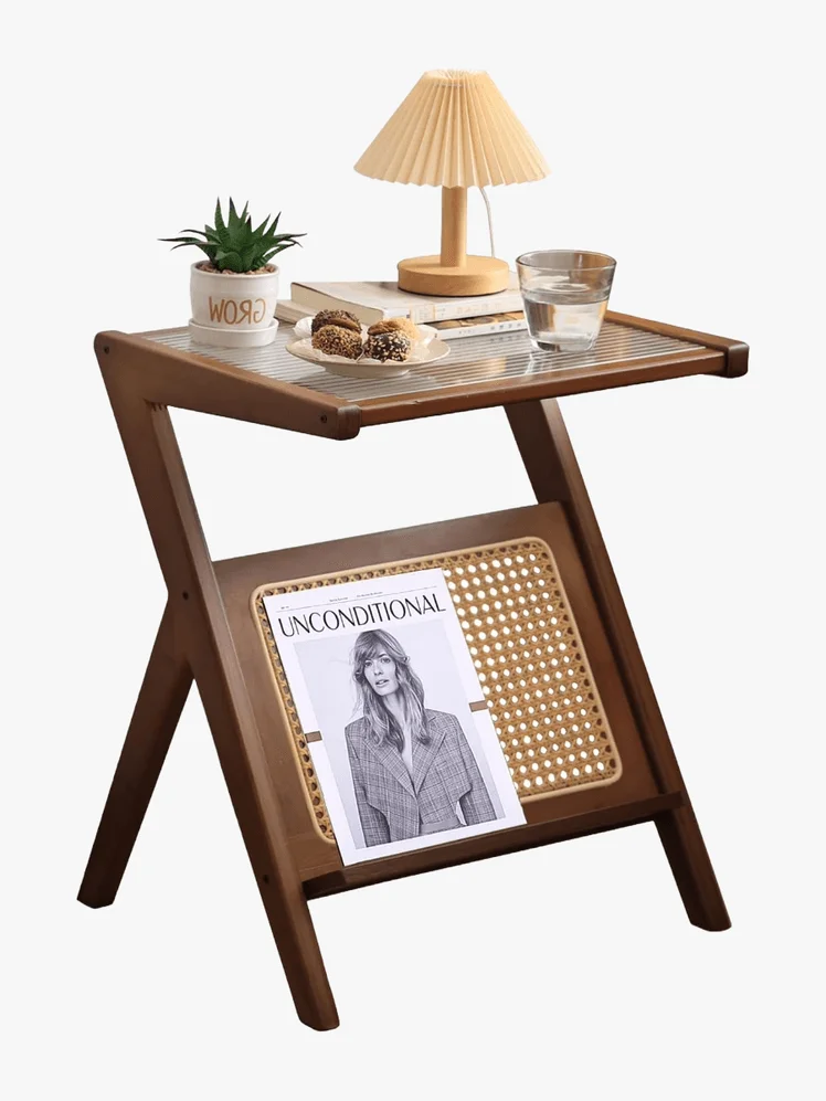 Image may contain: Julia Stegner, Furniture, Table, Coffee Table, Lamp, Table Lamp, Desk, Plant, and Dining Table