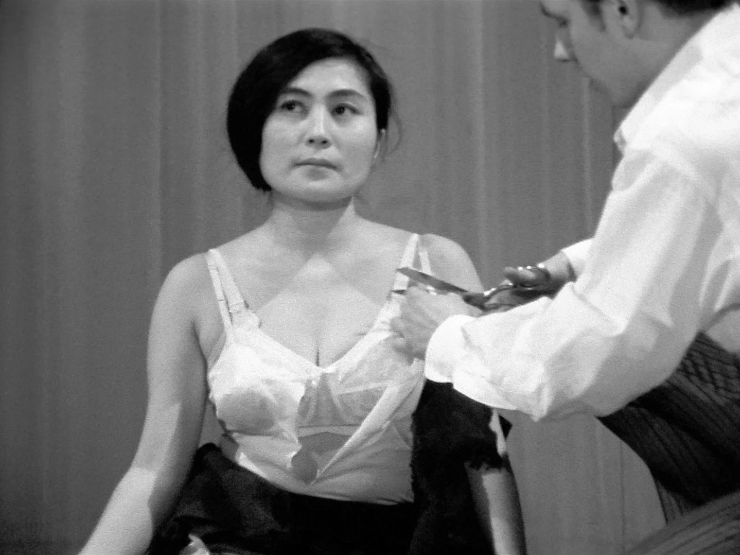 Image may contain Yoko Ono Body Part Finger Hand Person Cutlery Adult Wedding Face Head Clothing Dress and Spoon
