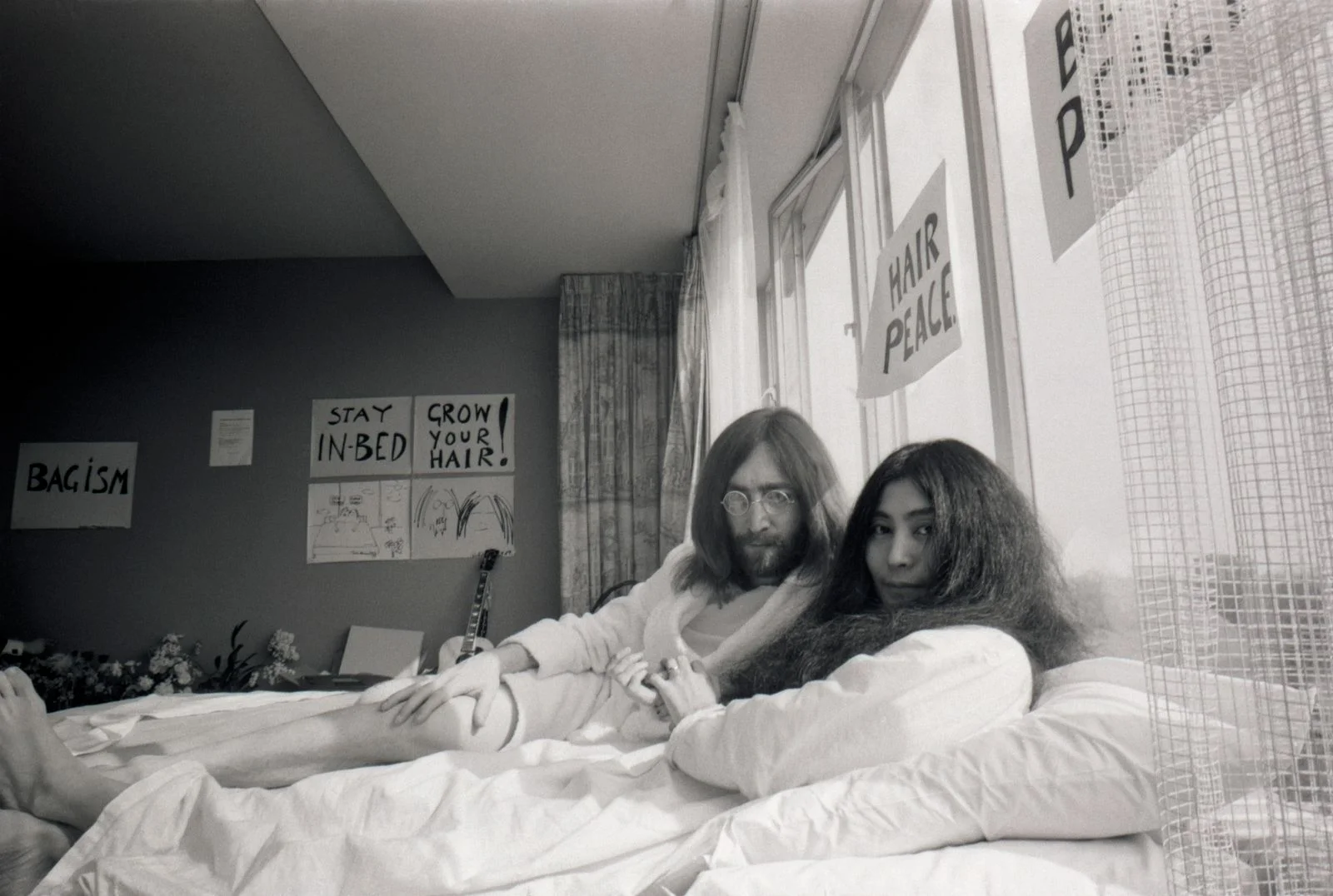 Image may contain Yoko Ono John Lennon Face Head Person Photography Portrait Adult Furniture Bed and Bedroom