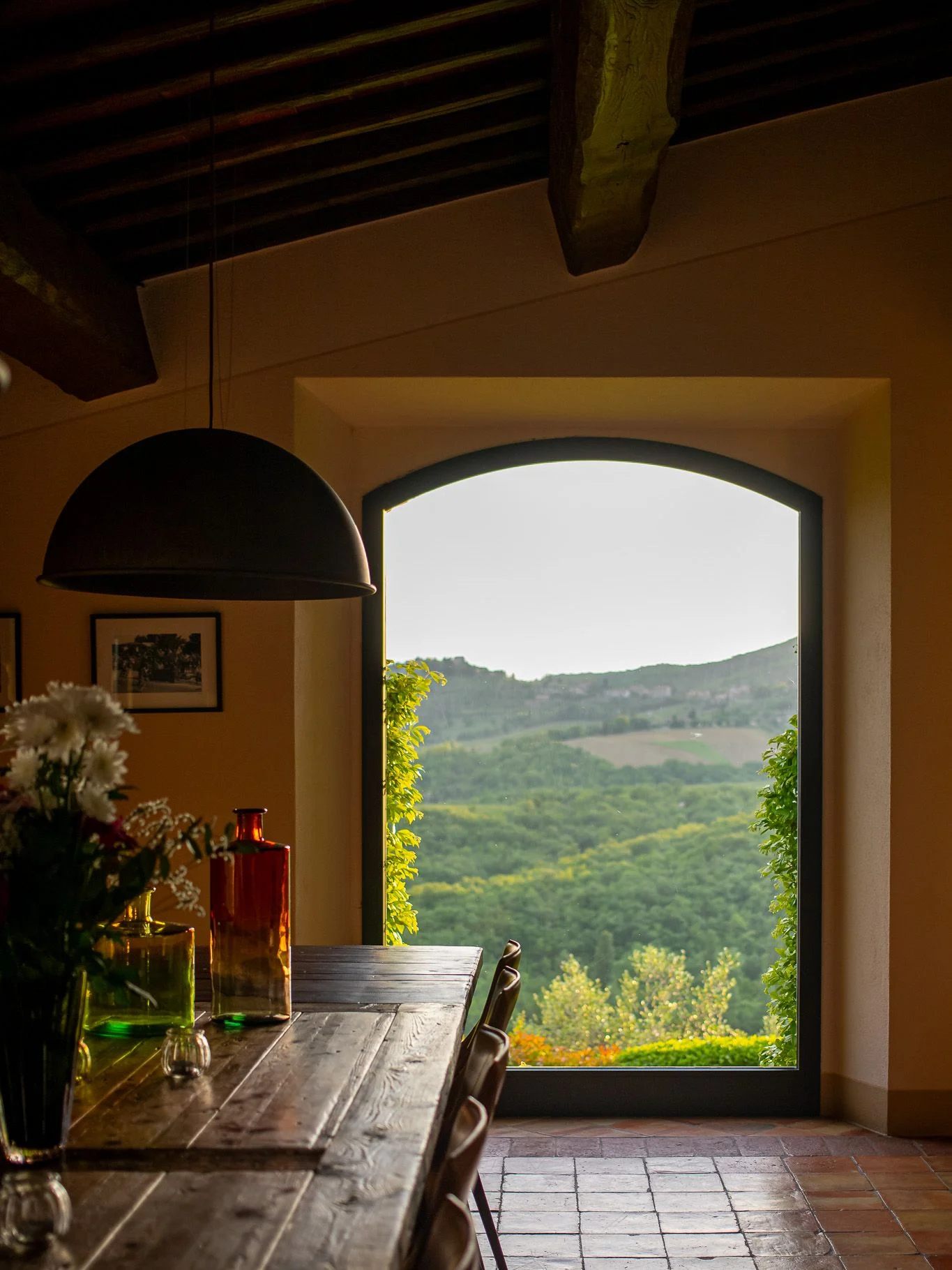 Image may contain Lamp Flower Flower Arrangement Plant Window Indoors Interior Design Furniture and Table