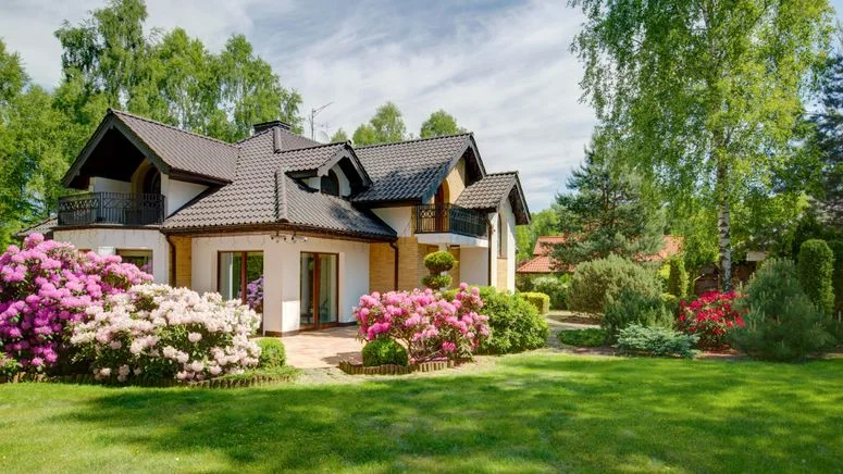 Image may contain: Grass, Plant, Architecture, Building, Cottage, House, Housing, Outdoors, Lawn, Nature, Backyard, and Yard