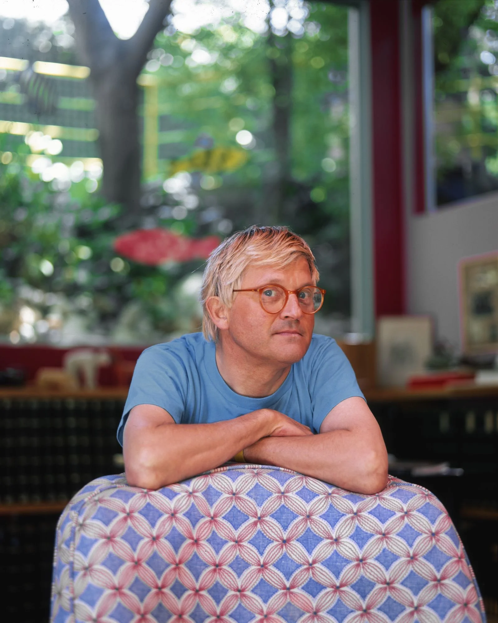 Image may contain David Hockney Furniture Adult Person Face Head Photography Portrait Sitting and Accessories