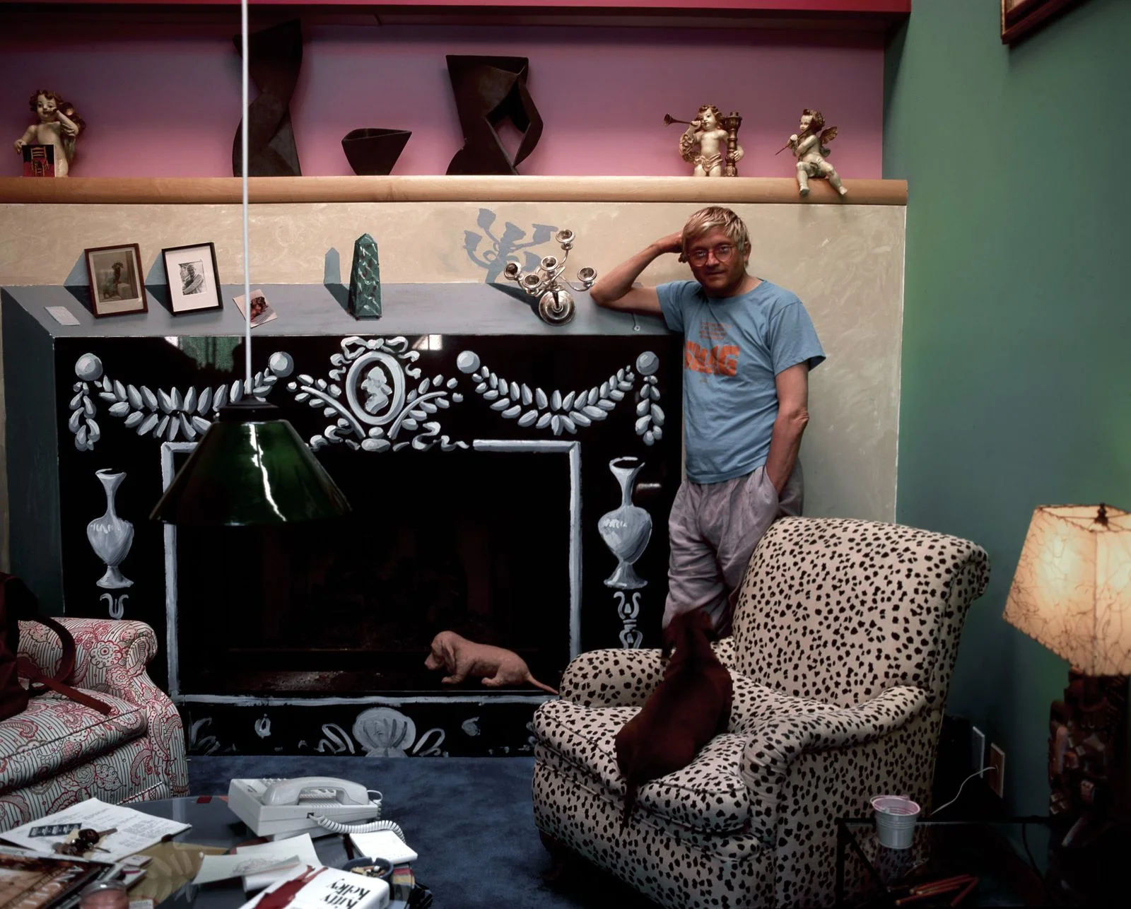 Image may contain David Hockney Clothing TShirt Architecture Building Furniture Indoors Living Room Room and Couch