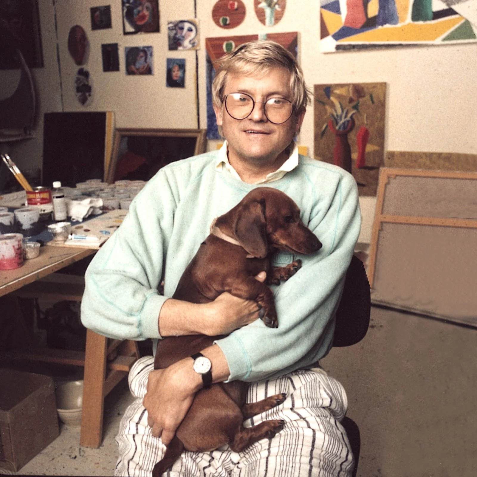 Image may contain David Hockney Face Head Person Photography Portrait Accessories Glasses Animal Canine and Dog