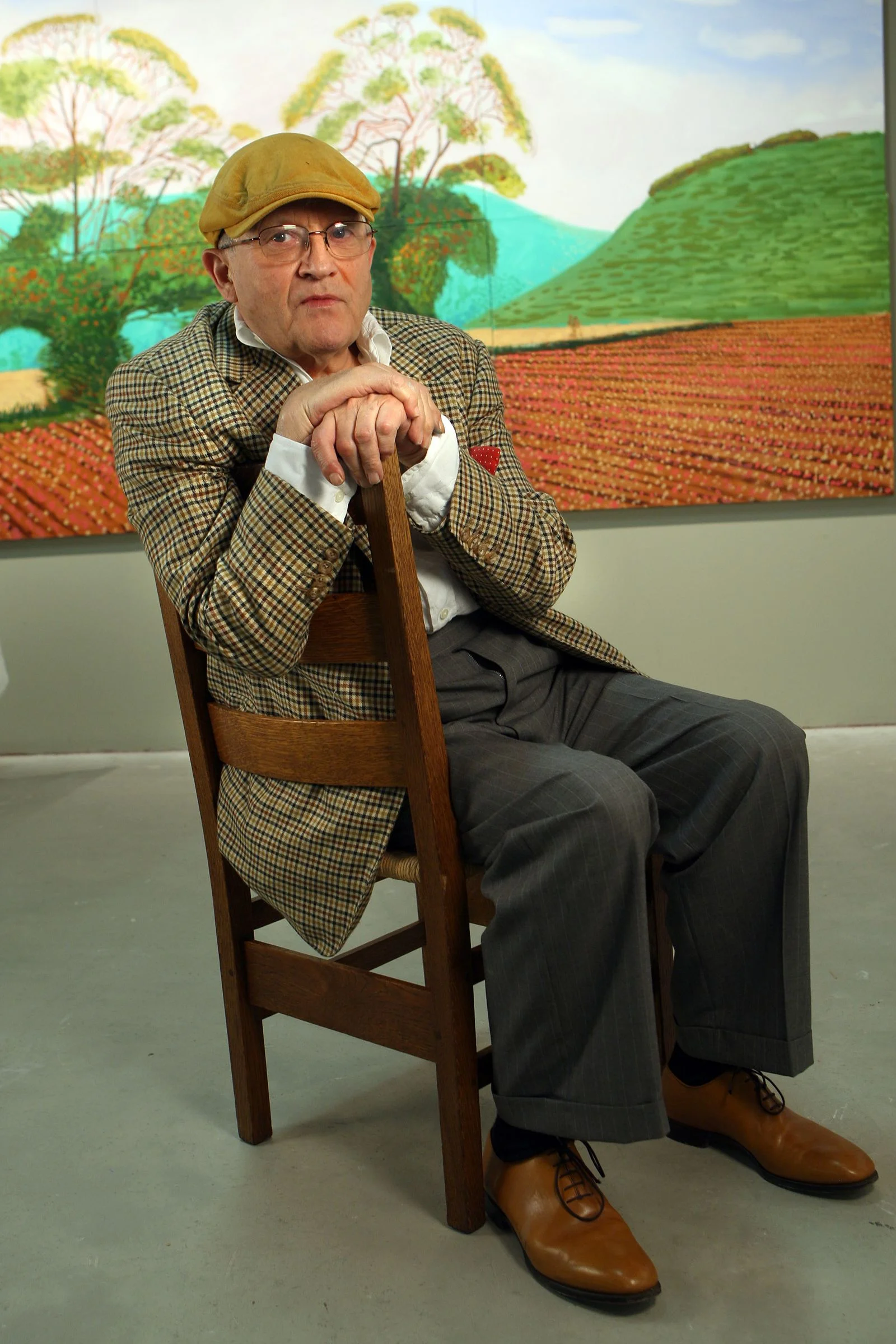 Image may contain David Hockney Person Sitting Adult Senior Citizen Face Head Photography Portrait and Clothing