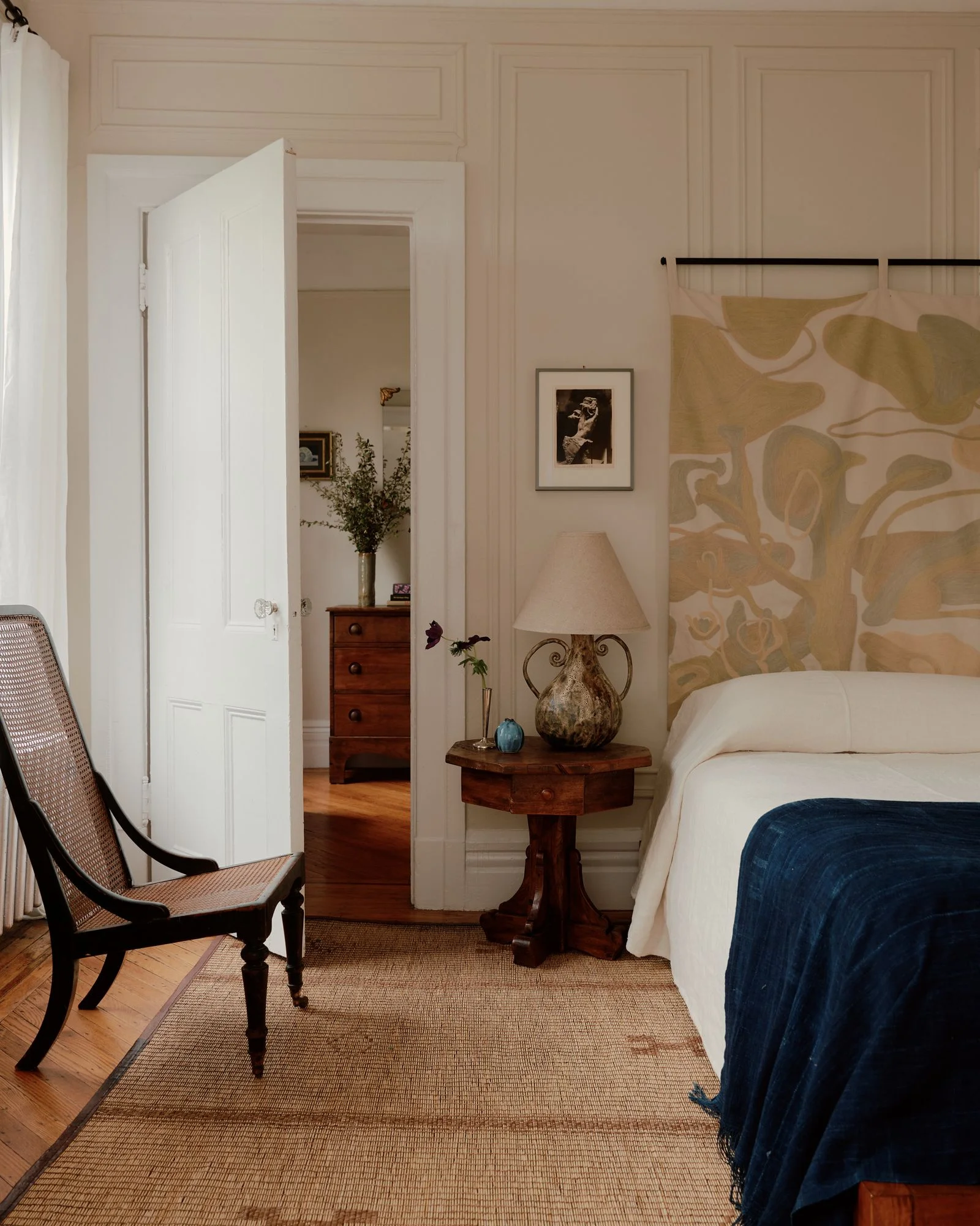 Image may contain Indoors Interior Design Lamp Home Decor Table Lamp Bed Furniture Chair Bedroom Room and Art