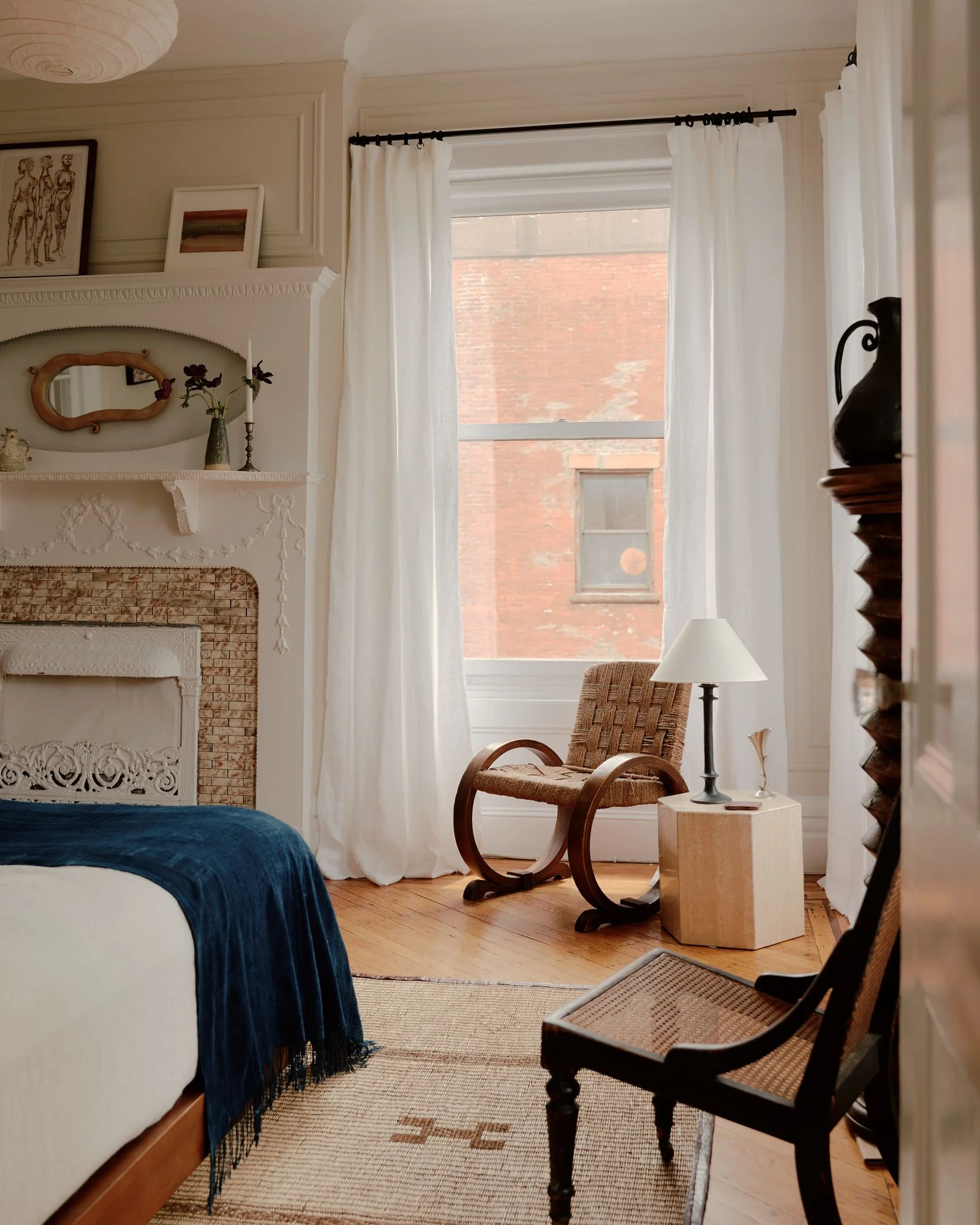 Image may contain Lamp Chair Furniture Home Decor Rug Indoors Interior Design Bed Bedroom and Room