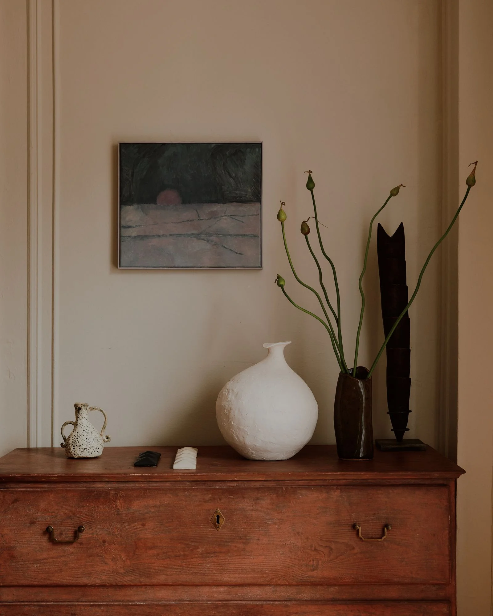 Image may contain Furniture Art Painting Jar Plant Flower Flower Arrangement Pottery Vase and Ikebana