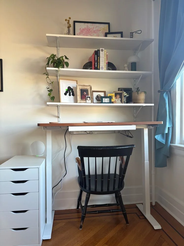 Image may contain: Furniture, Table, Desk, Chair, Plant, Art, Painting, and Person