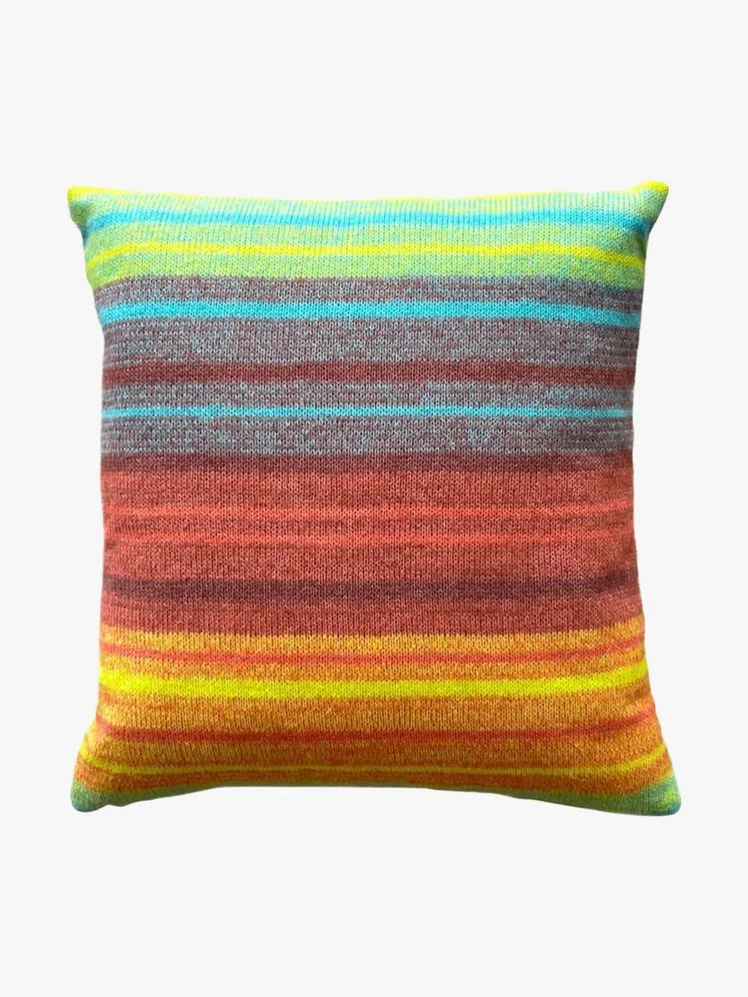 Image may contain: Cushion, Home Decor, Pillow, Clothing, Knitwear, and Sweater