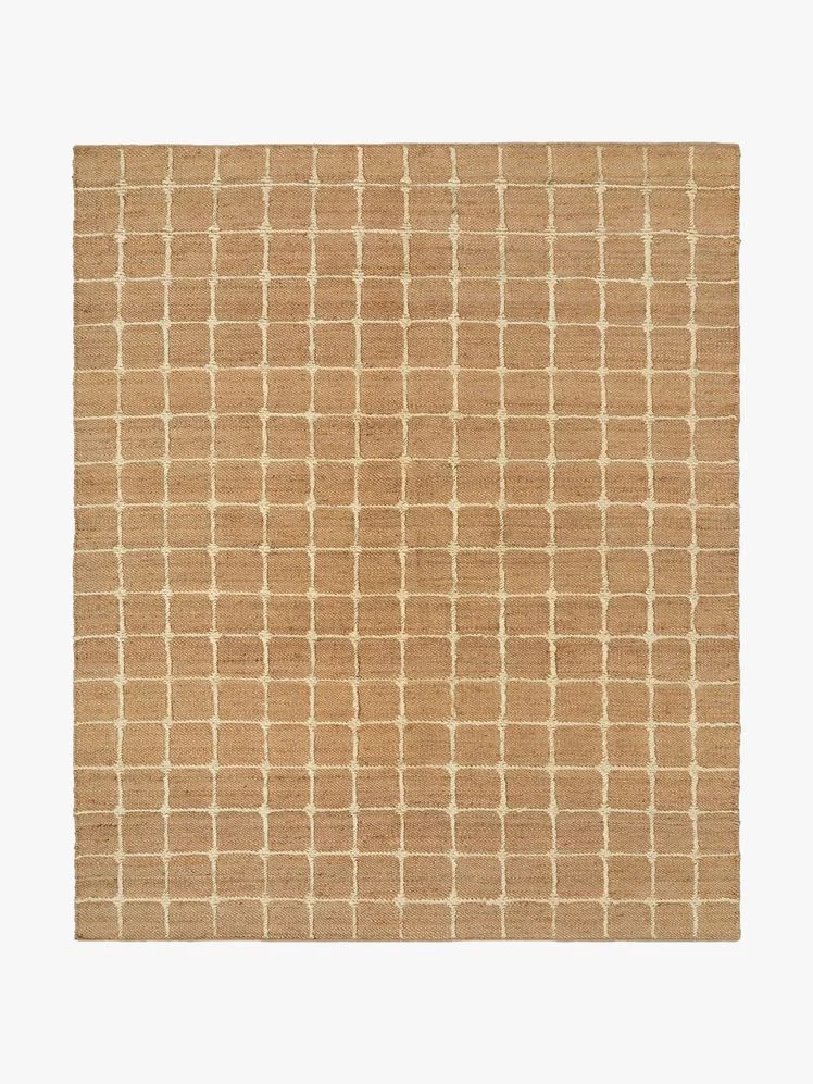 Brown rug with white grid pattern.