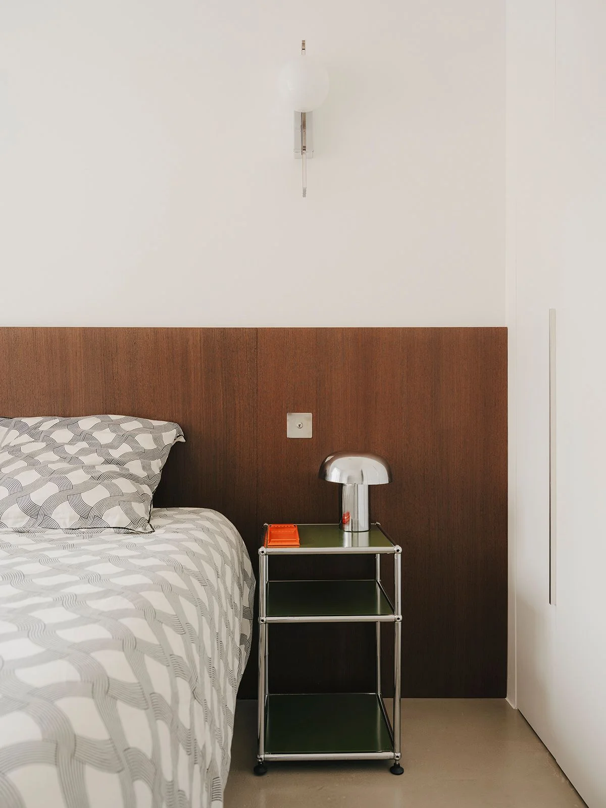 Image may contain Indoors Interior Design Furniture Wood Panels Cushion Home Decor Pillow Lamp Bed and Bedroom